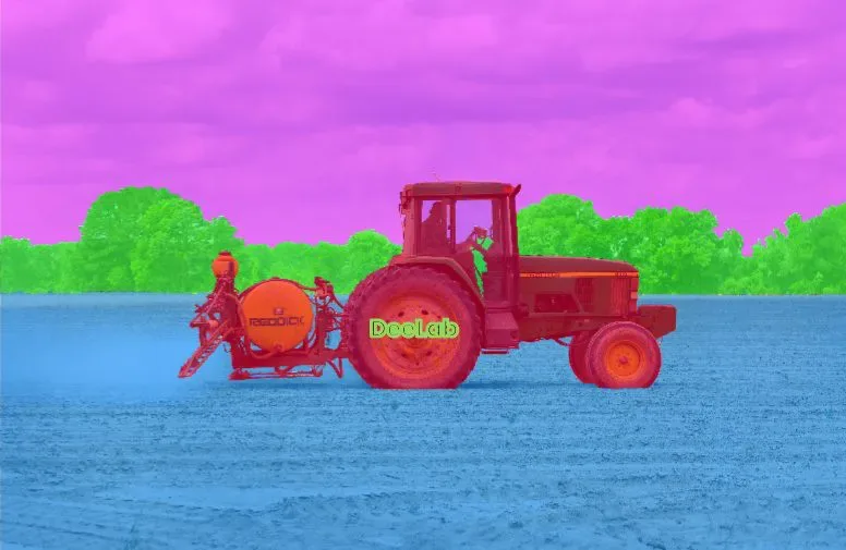 Semantic segmentation example: every pixel of a tractor, field and sky coloured by class